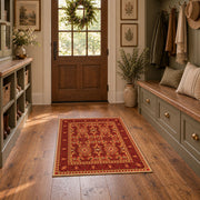 burnt orange traditional ornamental border area rug, wide interior view