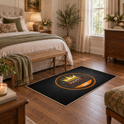 black and orange vintage sports badge design area rug, cozy home setting