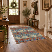orange and blue distressed tribal pattern area rug, wood floor styling