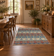 orange and blue distressed tribal pattern area rug, close decorative detail