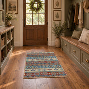 orange and blue distressed tribal pattern area rug, front room mockup