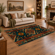 dark teal and orange tribal geometric pattern area rug, angled room view