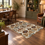 cream and brown floral mosaic tile pattern area rug, soft surface detail