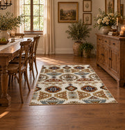 cream and brown floral mosaic tile pattern area rug, close decorative detail