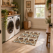 cream and brown floral mosaic tile pattern area rug, wide interior view
