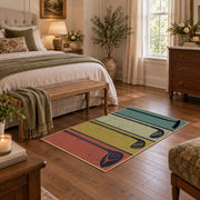 muted teal and tan retro bowling lane design area rug, cozy home setting