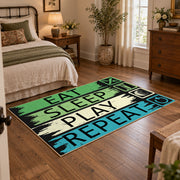 green blue eat sleep play repeat typography area rug, soft surface detail