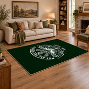 dark green compass wander quote area rug, angled room view