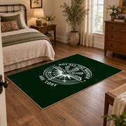 dark green compass wander quote area rug, soft surface detail