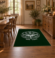 dark green compass wander quote area rug, close decorative detail