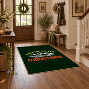 dark green take me to the mountains quote area rug, close decorative detail