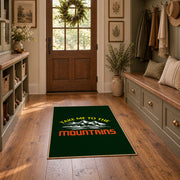 dark green take me to the mountains quote area rug, wide interior view