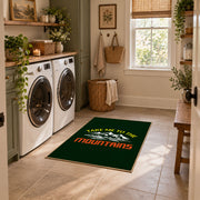 dark green take me to the mountains quote area rug, design detail view