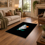 black sunset mountain adventure area rug, cozy home setting