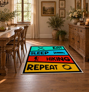 colorful eat sleep hiking repeat typography area rug, close decorative detail
