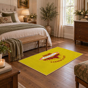 yellow red mountain sunrise badge area rug, cozy home setting