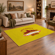 yellow red mountain sunrise badge area rug, angled room view