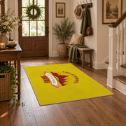 yellow red mountain sunrise badge area rug, close decorative detail