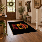 black orange vintage logger mountain area rug, close decorative detail