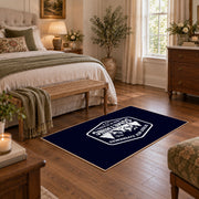 navy white mountain adventure badge area rug, cozy home setting