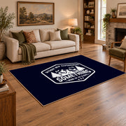 navy white mountain adventure badge area rug, angled room view