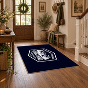 navy white mountain adventure badge area rug, close decorative detail