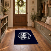 navy white mountain adventure badge area rug, wide interior view
