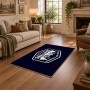 navy white mountain adventure badge area rug, design detail view