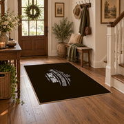 brown white wilderness mountain quote area rug, close decorative detail