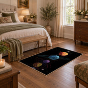 black colorful solar system planets area rug, cozy home setting