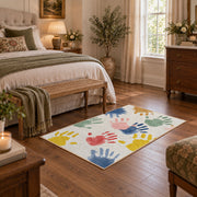 white pastel handprint art area rug, cozy home setting