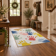 white pastel handprint art area rug, close decorative detail