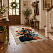 cream blue orange modern botanical abstract area rug, close decorative detail