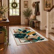 cream teal tropical leaf geometric area rug, close decorative detail