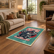 Motorcycle repair graphic area rug in teal, red, black, and cream, cozy home setting