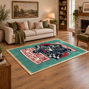 Motorcycle repair graphic area rug in teal, red, black, and cream, angled room view