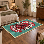 Skull motorcycle emblem area rug in red, teal, coral, and black, soft surface detail