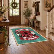 Skull motorcycle emblem area rug in red, teal, coral, and black, close decorative detail