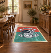 Vintage motorcycle mechanic area rug in teal, red, black, and cream, featured room view
