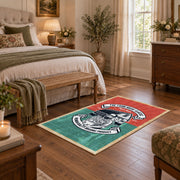 Vintage motorcycle mechanic area rug in teal, red, black, and cream, cozy home setting