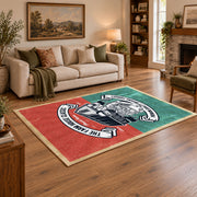 Vintage motorcycle mechanic area rug in teal, red, black, and cream, angled room view