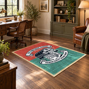 Vintage motorcycle mechanic area rug in teal, red, black, and cream, wood floor styling