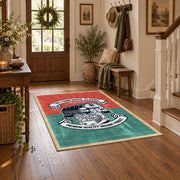 Vintage motorcycle mechanic area rug in teal, red, black, and cream, close decorative detail