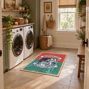 Vintage motorcycle mechanic area rug in teal, red, black, and cream, wide interior view