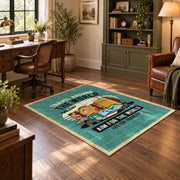 Retro camper travel area rug in teal, yellow, orange, and cream, wood floor styling