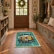 Retro camper travel area rug in teal, yellow, orange, and cream, wide interior view