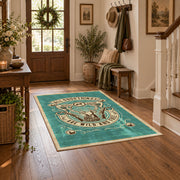 Hunting and fishing emblem area rug in teal, cream, brown, and black, wood floor styling