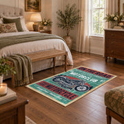 Vintage motorcycle graphic area rug in teal, red, cream, and black, cozy home setting