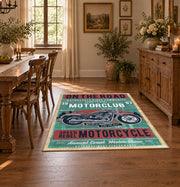 Vintage motorcycle graphic area rug in teal, red, cream, and black, close decorative detail