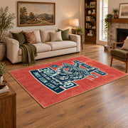 Skull mechanic workshop area rug in red, teal, cream, and black, angled room view